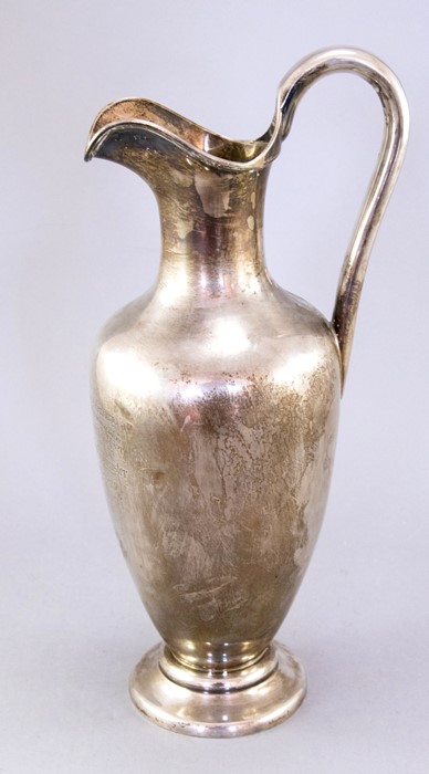 A mid Victorian silver claret jug/wine ewer, of classical form with military presentation