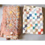 A patchwork quilt with diamond shaped patches in shades of mustard and grey and floral and patterned