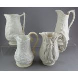 A group of early nineteenth century white stoneware relief moulded jugs, c.1830-50. To include: an