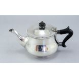 A George V silver bachelor teapot, circular bombe form, maker Lee & Wigfull, Sheffield 1932,