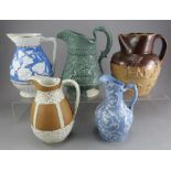A group of early nineteenth century stoneware relief moulded jugs, c.1830-50. To include: a green