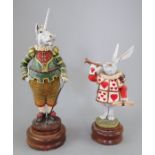 Two ceramic Alice in Wonderland figures by Carl Turner. Both on wooden bases. 20 - 27 cm tall. (2)