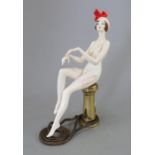 An Albany Fine China Co. model of a reclining lady incorporating a metal base, possibly from the '