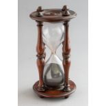 A mid 19th Century mahogany framed desk timer, circa 1860, turned supports and ends, height 18cm (