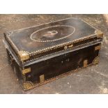 A 19th century camphorwood and leather trunk, with brass studs, the lid with an oval panel, with the