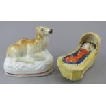 Two nineteenth century Staffordshire figure pieces, c.1830-40. To include a moulded figure of a baby