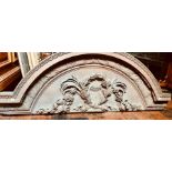 A 19th Century carved oak country house door pediment, moulded arch shape above a segment design