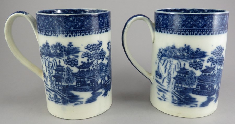 A pair of late eighteenth century blue and white transfer-printed quart tankards, c.1795. They are - Image 2 of 2