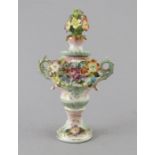 A nineteenth century heavily flower encrusted vase and cover by Sitzendorf, c. 1870. It has two
