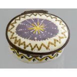 A Bilston enamel oval patch box, circa 1790, jewelled cover with a chevron border, width 4.5cm