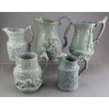 A group of early nineteenth century grey stoneware relief moulded jugs, c.1830-50. To include: a