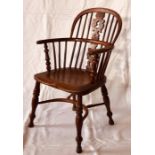 A late 18th Century yew wood and elm low back Windsor armchair, circa 1790, yew wood pierced splat