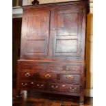 A George II Welsh oak linen press, circa 1750, Moulded Cornice above two panel moulded cupboards,