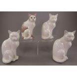 A group of four Albany Fine China Co. cats. One naturalistically decorated, three undecorated,
