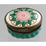 A Bilston enamel oval patch box, circa 1780, the cover with a jewelled stylized flower, width 4cm