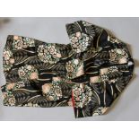 A 1920s Robe in the style of a Kimono, the crepe fabric has a Black background, decorated with a