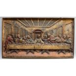 A 20th Century cast iron plaque depicting The Last Supper, polychrome detailing, 37 by 65cm