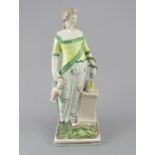 An early nineteenth century Staffordshire pearlware figure of Hygeia on a square base, c.1810-20. It