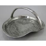 A Kayserzinn arts and crafts aesthetic movement metal tray with carrying handle and four bun feet,