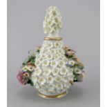 A nineteenth century continental porcelain lidded ointment or oil bottle made by John Petit of