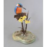An Albany Fine China Co. ceramic bird study incorporating metal. Modelled as a Kingfisher sitting on