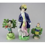 Three early nineteenth century Staffordshire pearlware figures, c.1820-50. To include: a bocage