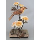 An Albany Fine China Co. ceramic bird study incorporating metal. Modelled as a Nightingale by