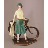 An Albany Fine China Co. model of 'Bicyclette' incorporating a metal base from the 'Travel in Style'