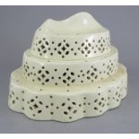 A fine late eighteenth century pierced creamware curd mould, c. 1795. It depicts a fish at the top