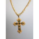 An emerald set cross and associated chain, the shaped cross set with fiver emeralds in collet