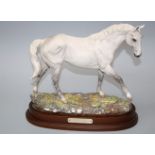 A limited edition Royal Doulton model of Desert Orchid. Numbered 3869, on stepped oval plinth.
