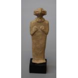 A Syro-Hittite style clay figure of hawk like anthropomorphic form.With stylised head dress. This