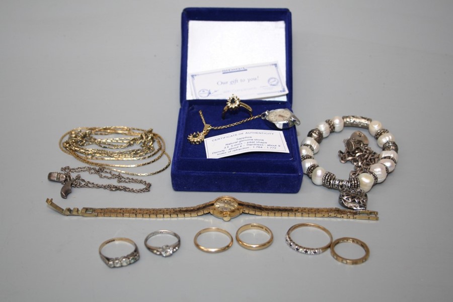 Two 9ct gold wedding bands, four further gold and silver rings and a small quantity of costume