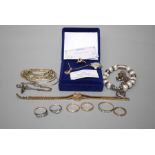 Two 9ct gold wedding bands, four further gold and silver rings and a small quantity of costume