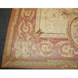 A 20th century, Aubusson style ivory ground tapestry carpet of architectural neoclassical form.