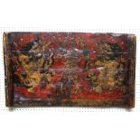 An old Tibetan painted wood panel  decorated with guardian lions and a central vajra on a red