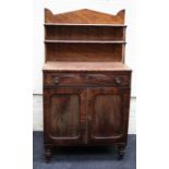 A Regency, ebony strung mahogany, two door chiffonier with up-stand back. Raised on turned supports.