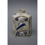 A George III pearlware tea caddy of shouldered form with four fluted sides, decorated in shallow