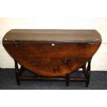 A late 17th century oval, oak, single drawer, gateleg table with turned under-frame. 124cm long