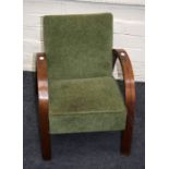 A circa 1930's child's chair with bentwood arms and apple green upholstery.