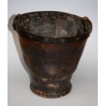 A late 18th century /early 19th century iron banded leather fire bucket with strap handle. 25cm