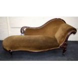A Victorian carved mahogany single, scroll ended chaise longue  with cabriole supports. 2mtrs long