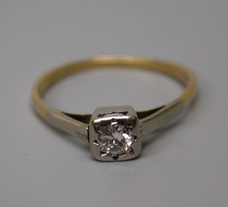 A single stone diamond ring, the old brilliant cut diamond, in carved illusion mount, tapering