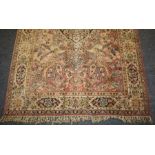 A probably Belgian knotted pile rug of "book-cover" design. 197 x 130cm