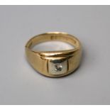 A single stone diamond ring, the brilliant cut diamond, flush set into a tapering 9ct gold