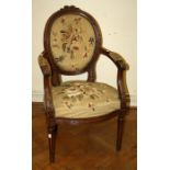 A Louis XVI style cameo back fauteils with floral tapestry upholstery