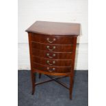 An Edwardian mahogany, bow fronted, pedestal, sheet music cabinet. 54cm wide