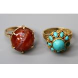 A turquoise cluster ring, the central raised turquoise above a band of navette shaped turquoise to a