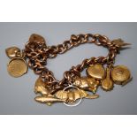 A charm bracelet, the curb pattern bracelet with padlock clasp, marked '9c'; suspending eleven