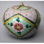 An early  20th century Chinese Peranakan ware spice jar and cover, typically boldly decorated with